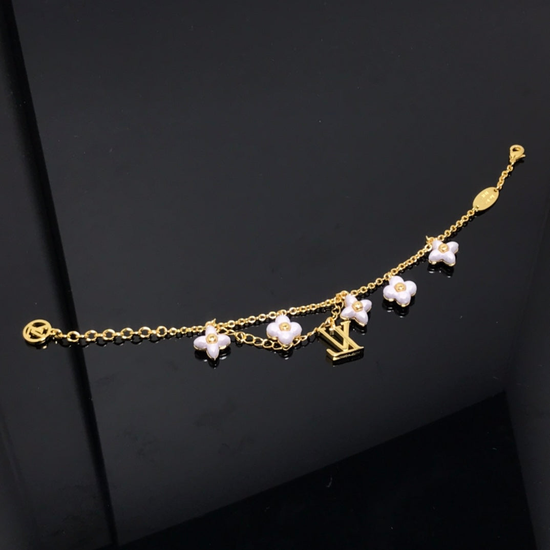 LOUIS VUITTON LOGO 6 MOTIF STAR AND SUN GOLD BRACELET